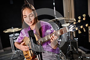 jolly adorable teenage guitarist in vivid