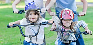 Jolly children riding a bike