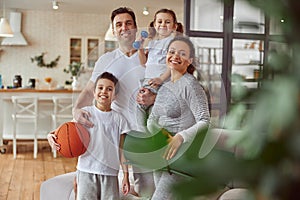 Jolly family exercising together in living room