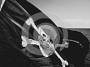 Jolly Rogers pirate flag flying from a sailing boat