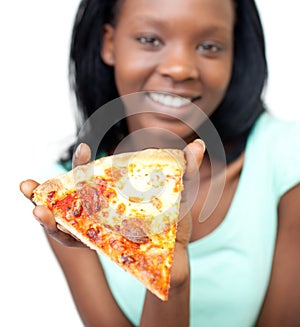 Jolly teen girl showing a slice of pizza