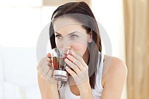 Jolly woman drinking tea