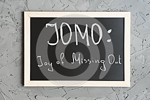 JOMO or Joy of Missing Out concept