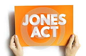 Jones Act - foreign carriers and crews are banned from domestic water routes, text concept on card