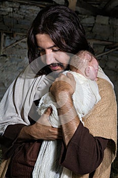 Joseph hugging baby Jesus