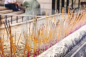 Joss sticks. Burning incense sticks. A close up of burning incense sticks