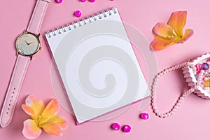 Jotter on a pink background with women`s ornaments. Valentine`s Day