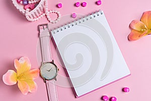 Jotter on a pink background with women`s ornaments. Valentine`s Day