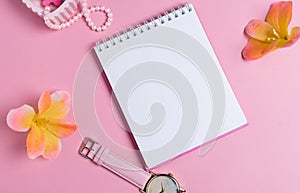 Jotter on a pink background with women`s ornaments. Valentine`s Day