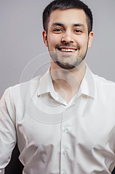 A jouful businessman in a white shirt