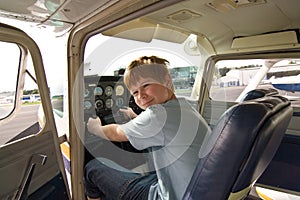 Joung boy in the pilot seat at