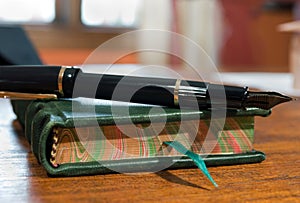 Journal and pen on desk