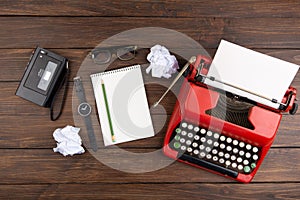Journalism or blogging concept vintage typewriter on the wooden desk, top view