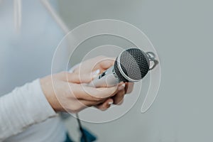 Journalist in hand holding microphone and dictaphone sound recorder at NEWS conference