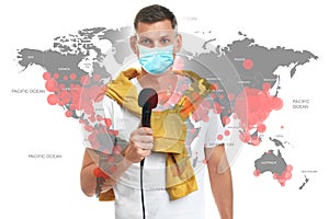 Journalist with medical mask presenting news during coronavirus. World map demonstrating spread of disease