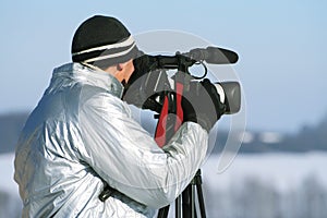 The journalist with a videocamera photo