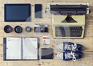 Journalistic equipment: typewriter, tablet, phone, camera