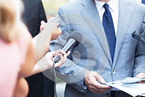 Journalists making media interview with business person or politician