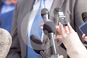 Journalists making media interview with businessperson or politician
