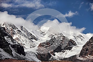 Journey through Altai mountains to Aktru. Hiking to snowy peaks of Altai mountains. Survival in harsh conditions, beautiful nature