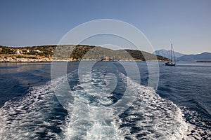 The journey continues - back view from the sea on the coast of the KASTOS island, Lefkada Regional unit, Ionian Islands