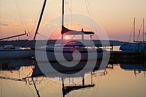 Journey on a sailing boat.Summer travel.Sunrise over the lake.