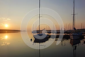 Journey on a sailing boat.Summer travel.Sunrise over the lake.