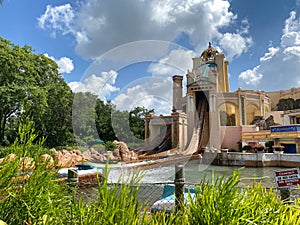 The Journey to Atlantis Roller Coaster water ride at SeaWorld speeding around the track and splashing into the water