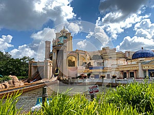 The Journey to Atlantis Roller Coaster water ride at SeaWorld speeding around the track and splashing into the water