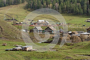 Journey to the Russian village. The typical appearance of a modern village in the Altai Mountains.