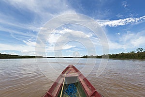 Journey on a wooden boat on Beni river near Rurrenabaque, blue s photo