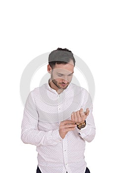 Portrait of a handsome young man tying his shirt photo
