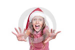 Jovial girl in santa claus hat photo