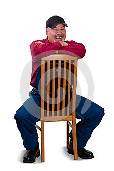 Jovial vivacious worker sitting laughing photo