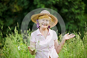 Joy. Friendly Happy Mature Woman in Straw Hut with Stretched Arms