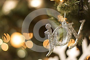 Joy ornament on christmas tree