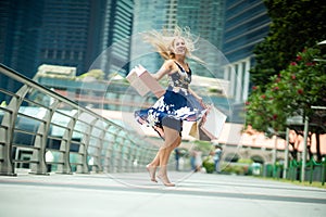 The Joy of Shopping... Excited Beautiful Woman wearing casual b