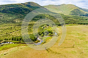 Joyce's river winding down below in Connemara region in Ireland. Scenic Irish countryside landscape