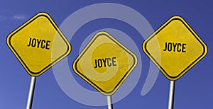 Joyce - three yellow signs with blue sky background