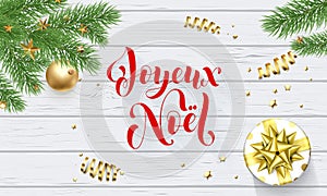 Joyeux Noel French Merry Christmas golden decoration and calligraphy font on white wooden background for greeting card. Vector Chr