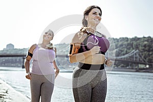 Joyful active woman having a morning run