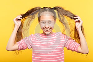 Joyful adolescent girl pig tails hair childish