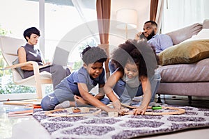 Joyful African American Family Playing with Toys, Perfect for Family-Oriented Projects