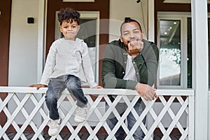 joyful african american father and son