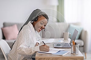 Joyful african american woman attending online course