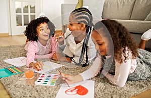 Joyful African Mother And Daughters Drawing Having Fun At Home