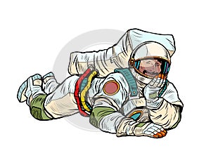 The joyful astronaut is lying down. Relaxed funny pose. Peace and relaxation