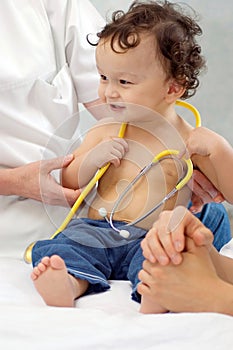 Joyful baby at the doctor.