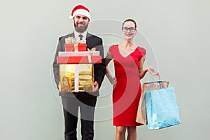 Joyful bearded business man in red hat and business woman in red