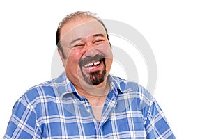 Joyful bearded Caucasian man laughing loud